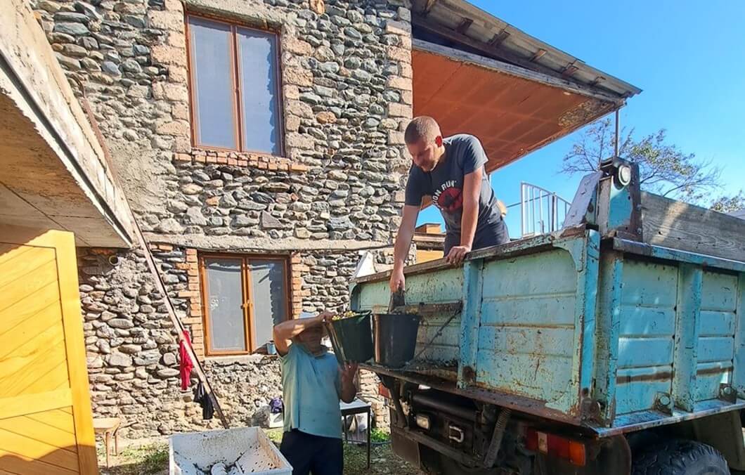 Pressing the grapes in front of our wine cellar in Eniseli